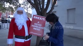 Christmas-themed protesters on the streets of London ahead of no-confidence vote