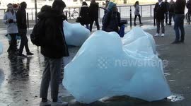 Tourists experience global warming first hand at new ice berg art installation at Tate Modern