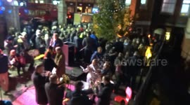 Silent Night, Holy Night Christmas song performed by Fulham Brass Band musicians at Celebrate a Life carol service at Royal Marsden Hospital in Chelsea