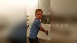 Son's reaction is priceless when dad scares him from behind