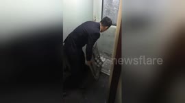 Train door in China freezes solid and has to be broken out by staff