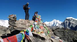 Magical view from flag-covered mountain peak in Nepal