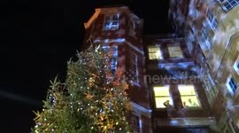 Staff and patients seen in the windows as Royal Marsden Hospital Celebrates a Life with a carol service