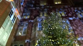 Star-shaped light projections on the walls of Royal Marsden Hospital during Celebrate a Life carol service in Chelsea