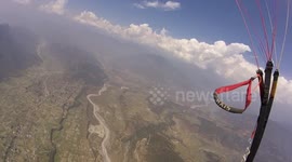 Paragliding jumping over big valleys in Nepal