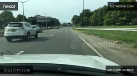 Dash cam video guy crossing middle of the highway
