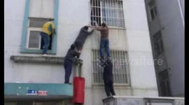 Kind-hearted neighbours save toddler hanging from second-floor window