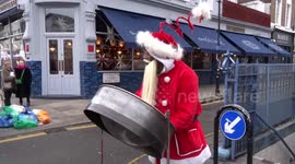 Black Santa is playing Trinidad Steel Pan at Portobello Road Christmas Market