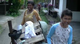 West Sumatran mother-of-three scavenges with her kids so she can send them to school