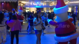 Santa character with Xmas reveller .