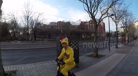 Xmas Pikachu riding the streets of Paris: Funny oldman wearing a Pikachu costume and a Christmas hat, riding an electric bicycle in the wrong way of the bicycle lane.(GoPro view). 17 December 2018.