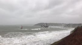 Lifeboat and two tugboats approach grounded Russian tanker off Cornish coast