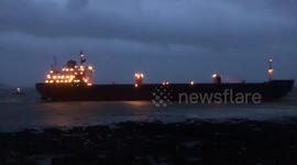 Night shots show Russian cargo ship stranded on UK beach during low tide