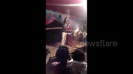 Man fires gun point-blank at Indian wedding dancer, narrowly missing her