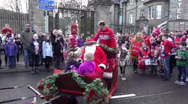 Reindeer pull santa's sleigh through streets for Dunkeld Santa Day 2018