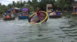 You spin me right round! Tourists take spinning basket boat challenge