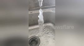 Water running out of tap freezes solid in midair in northern China