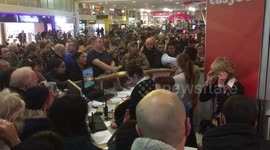 Travellers mob Gatwick service desk only to be told all flights are cancelled