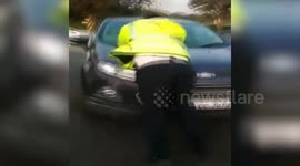 Motorist tries to run over traffic police, drives on with cop on car's bonnet to avoid paying fine in India