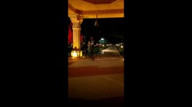 Reverse of child playing in temple.