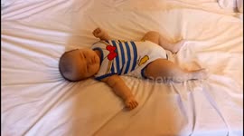 Cute and funny baby keeps shaking his head