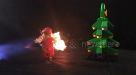 Spinning Lego Santa Claus gets set on fire with blow torch in slow motion