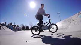 Cool young man shows amazing tricks on a BMX Bike