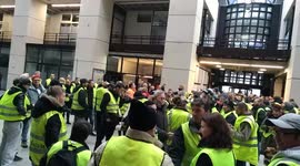 Yellow vest protesters enter town hall and sing French national anthem