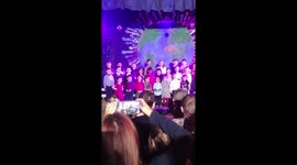 Little girl lifts dress at Christmas concert