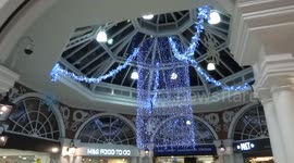 Christmas lights sparkle in Kensington Arcade at High Street Kensington tube station