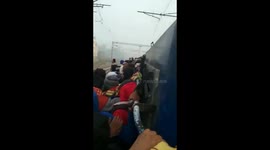Indian students forced to cling to outside of train to sit police exam