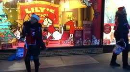 Christmas carolling for charity outside Whole Foods in Kensington High Street