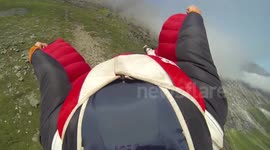 Daredevil wingsuit flyer skims Norwegian mountain