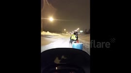 Snowmobiles patrol the streets of Buffalo, New York