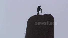 Man demolishes industrial chimney brick-by-brick