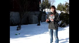 Girl fails to catch the snowball and is hit in the head in 200 fps