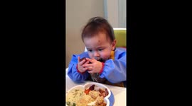 baby Kainoa chowing down on turkey on Thanksgiving!