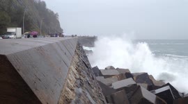 Large waves batter the seafront in San Sebastian Spain