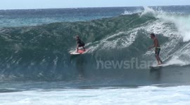 Five-year-old surfs a huge wave in Hawaii