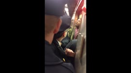 Tired NYC protesters take it to the 42nd street Grand Central 4 train.