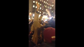 On 49 & 6 Ave attempting to push down the barricades.