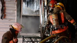 Fire fighters at the aftermath of a house fire in Fort Erie, Ontario