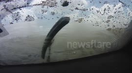 Racing car flies through the air at off-road race in South Africa