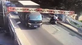 Narrow escape for scooter riders as height barrier nearly takes their heads off