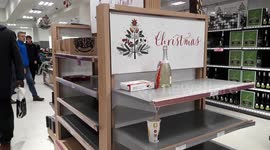 They've cleaned us out! Empty shelves and long queues at Waitrose on Christmas Eve