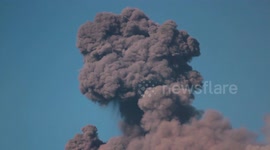 Italy's Mount Etna shakes, rumbles and spews massive columns of ash on Christmas Eve