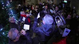 Leeds residents sing Silent Night around the Christmas Tree