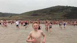 Taking the plunge: Hundreds run into sea near UK's Land's End on Christmas Day