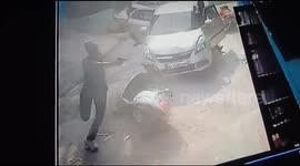 Shocking video - Delhi gang war caught on cam . Man hit by car and shooted