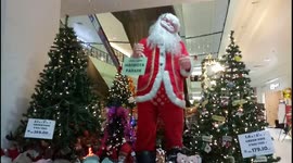 Cute Santa Singing Christmas Song to Everyone Who Comes Closer to Him
